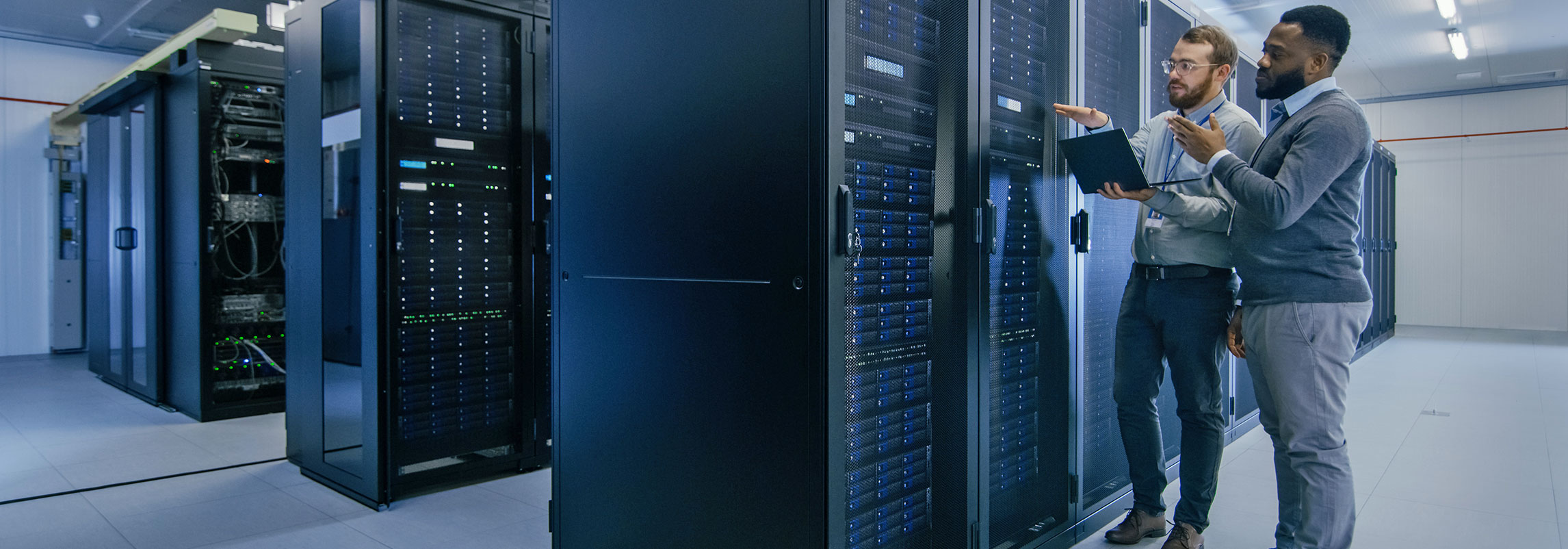 Technicians having Discussion in Server Room
